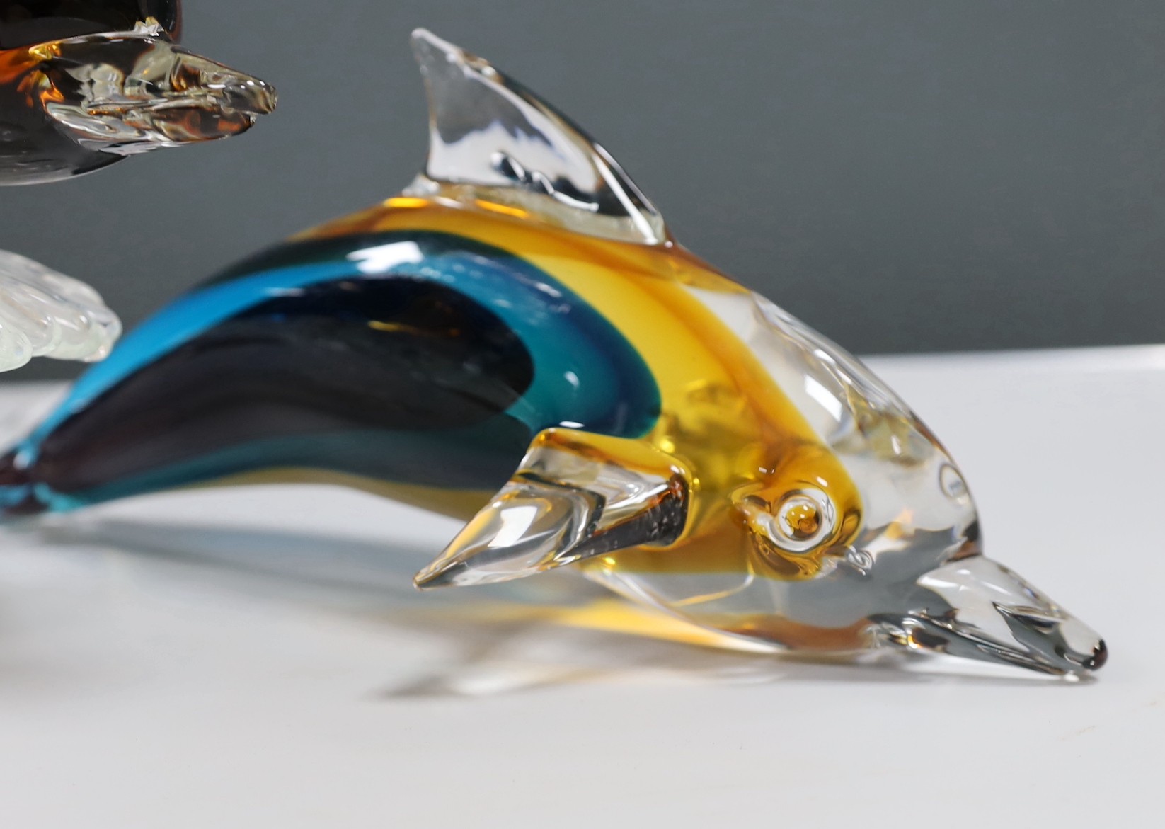 A large Murano Sommerso glass double Dolphin sculpture by Oscar Zanetti, engraved signature and paper label, minor faults to one dolphin, 61cm high